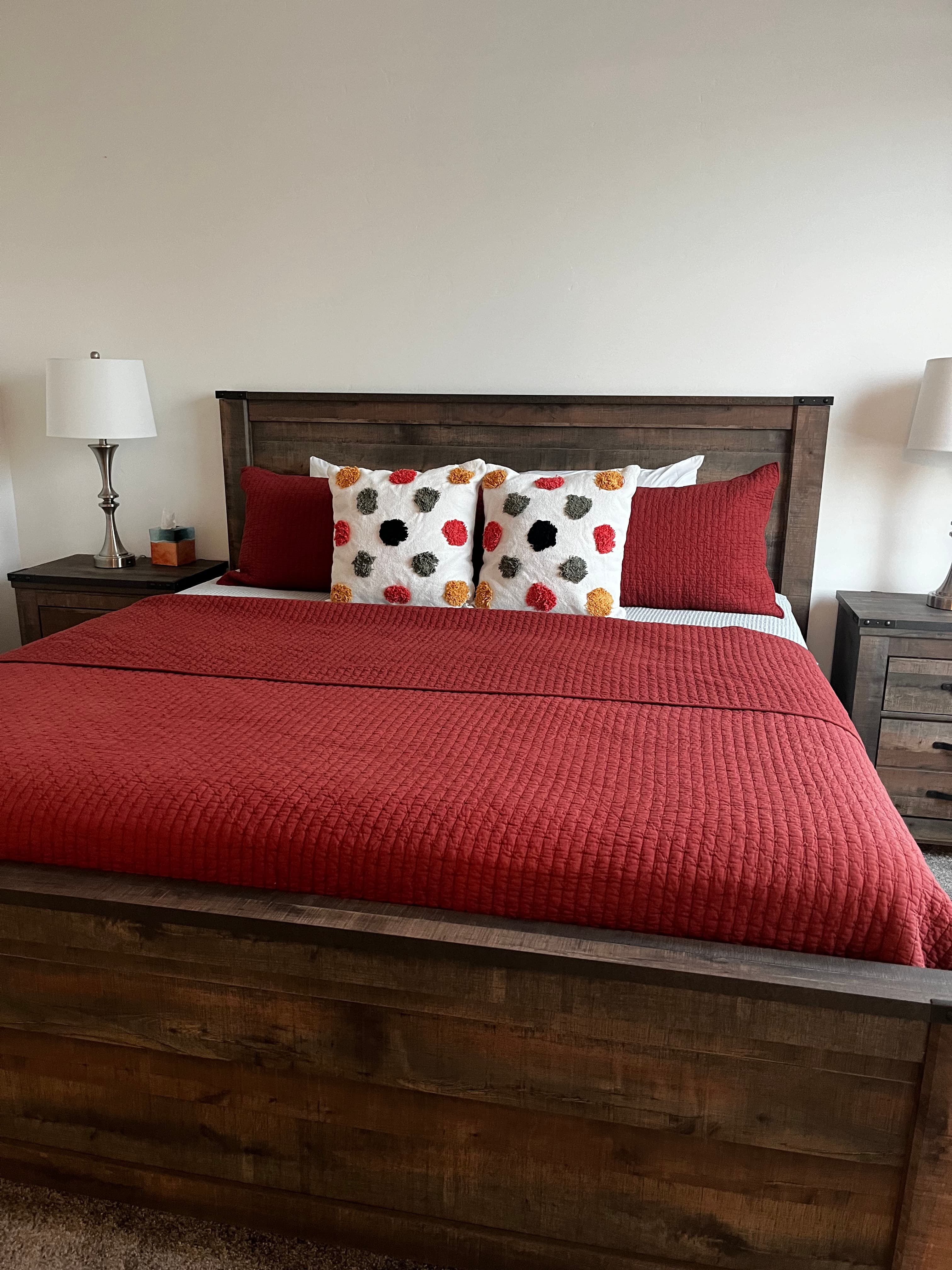 Neatly staged bedroom with crisply made bed after cleaning