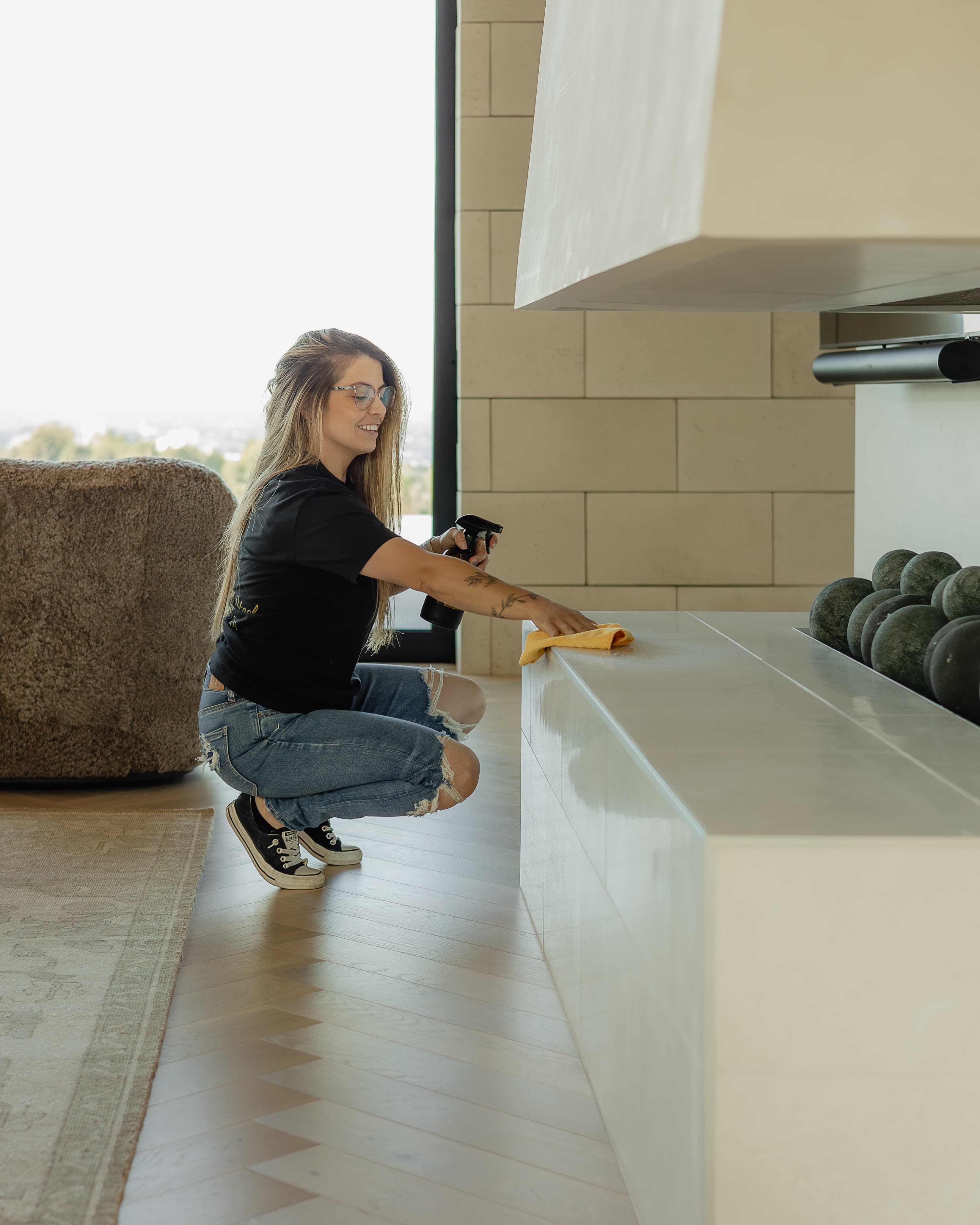 Feather & Steel cleaner detailing a modern fireplace hearth