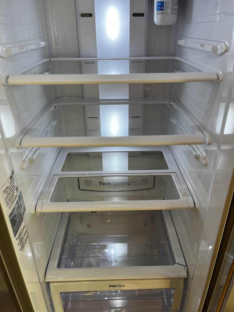 Spotless empty refrigerator interior after a detail clean